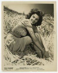 4d325 JANE RUSSELL 8x10.25 still '46 wonderful sexy image sitting in haystack in The Outlaw!