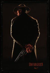 4k944 UNFORGIVEN teaser DS 1sh '92 image of gunslinger Clint Eastwood w/back turned, dated design!