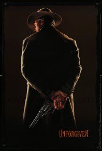 4k943 UNFORGIVEN teaser 1sh '92 image of gunslinger Clint Eastwood w/back turned, undated design!