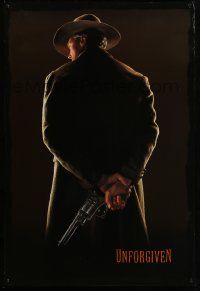 4w943 UNFORGIVEN teaser 1sh '92 image of gunslinger Clint Eastwood w/back turned, undated design!