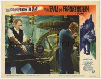5c644 EVIL OF FRANKENSTEIN LC #8 '64 Peter Cushing reaching into water tank in his laboratory!