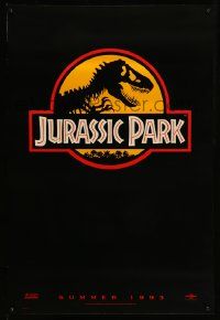 5g497 JURASSIC PARK teaser 1sh '93 Steven Spielberg, classic logo with T-Rex over yellow background