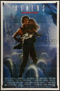 5j043 ALIENS 1sh '86 James Cameron, Sigourney Weaver as Ripley holding Carrie Henn!