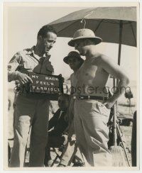 5m791 SAHARA candid 8.25x10 still '43 Humphrey Bogart uses sign to tell everyone how his back feels!