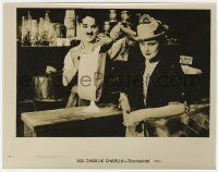 5m872 SUNNYSIDE 8x10.25 still R27 Charlie Chaplin distracted by pretty woman while pouring flour!