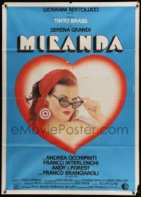 5p212 MIRANDA Italian 1p '85 great Crovato art of sexy Serena Grandi lowering her sunglasses!