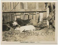 6d022 DOG'S LIFE 8x10.25 still R20s close up of Charlie Chaplin laying on ground with dog by fence!