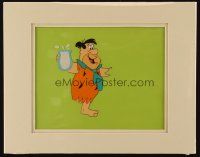 6d163 PEBBLES CEREAL matted animation cel '80s cartoon image of Fred Flintstone carrying milk!