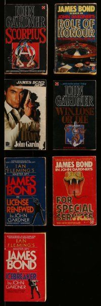 6h203 LOT OF 7 JAMES BOND JOHN GARDNER PAPERBACK BOOKS '80s Scorpius, Role of Honour & more!