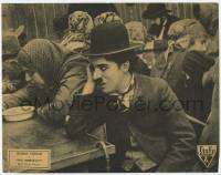 6j241 IMMIGRANT LC R32 great close up of worried Charlie Chaplin at table with other immigrants!