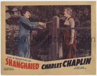 7c831 SHANGHAIED LC R40 Tramp Charlie Chaplin romances rich woman across gate with his cane!