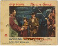 7c948 UNCONQUERED LC #2 '47 c/u of sexy Paulette Goddard behind Gary Cooper holding two guns!