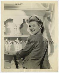 7d564 LAURA LA PLANTE 8x10 still '30s smiling over her shoulder by cabinet of ceramic figurines!