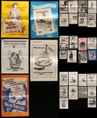 7h070 LOT OF 31 UNCUT PRESSBOOKS '50s-70s advertising images for a variety of different movies!