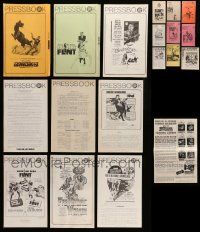 7h068 LOT OF 32 UNCUT PRESSBOOKS '50s-70s advertising images for a variety of different movies!