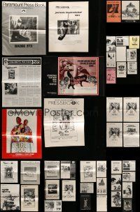 7h059 LOT OF 55 UNCUT PRESSBOOKS '70s advertising images for a variety of different movies!