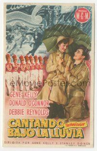 7s922 SINGIN' IN THE RAIN Spanish herald '53 Gene Kelly & Debbie Reynolds under umbrella, different