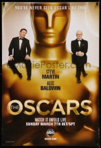 7w512 82ND ANNUAL ACADEMY AWARDS 1sh '10 Steve Martin and Alec Bladwin sitting on Oscar statue!