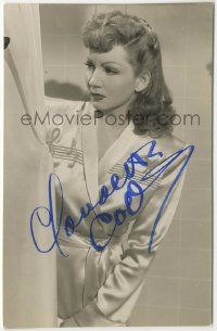 7x0607 CLAUDETTE COLBERT signed 3.5x5.5 still '80s great c/u wearing robe with music notes!