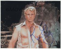 7x1144 RON ELY signed color 8x10 REPRO still '00s great close up in torn shirt as Doc Savage!