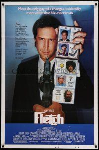 7z336 FLETCH 1sh '85 Michael Ritchie, wacky detective Chevy Chase has gun pulled on him!