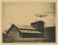 8f439 BELL HOP LC '21 great image of man on roof of huge barn picked up by bi-plane's rope ladder!