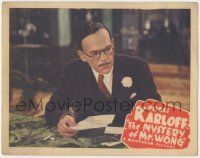 8f769 MYSTERY OF MR WONG LC '39 close up of Asian detective Boris Karloff examining letter!