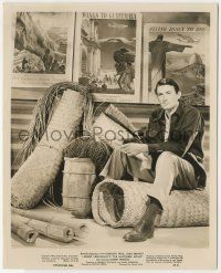 8r595 MACOMBER AFFAIR 8x10 still '47 Gregory Peck sitting in front of great travel posters!