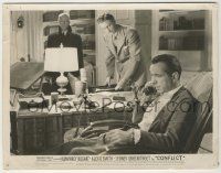 9m197 CONFLICT 8x10.25 still '45 two men suspiciously watch Humphrey Bogart talking on phone!
