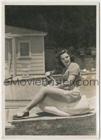 9m436 JUDY GARLAND deluxe 7.75x10 still '40 sitting on fake swan by her swimming pool at home!