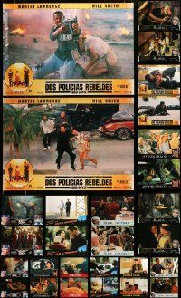 9x307 LOT OF 32 MOSTLY UNFOLDED SPANISH 18X26 POSTERS '90s scenes from several different movies!