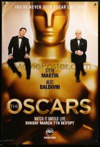 1g048 82ND ANNUAL ACADEMY AWARDS DS 1sh '10 Steve Martin and Alec Bladwin sitting on Oscar statue!