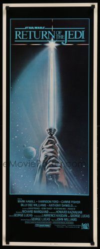 1h906 RETURN OF THE JEDI int'l insert '83 George Lucas, art of hands holding lightsaber by Reamer!