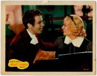 1k739 HEARTS DIVIDED LC '36 close up of pretty Marion Davies smiling at Dick Powell by piano!