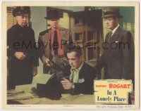 1k755 IN A LONELY PLACE LC #7 '50 cops with guns arrest screenwriter Humphrey Bogart, Nicholas Ray