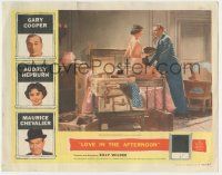 1k811 LOVE IN THE AFTERNOON LC '57 Audrey Hepburn sitting on packed suitcase by Gary Cooper!