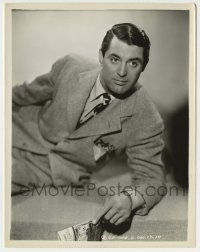 1s198 CARY GRANT 8x10.25 still '40s great close portrait in suit & tie with train magazine!