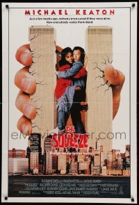 1t770 SQUEEZE int'l 1sh '87 wacky image of giant Michael Keaton being crushed by Twin Towers!