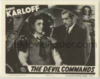 1y036 DEVIL COMMANDS LC R55 close up of Boris Karloff putting man into iron torture device!