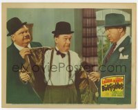 2d104 BULLFIGHTERS LC '45 Oliver Hardy removes Stan Laurel's coat as Ralph Sanford threatens them!