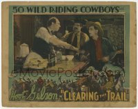 2d133 CLEARING THE TRAIL LC '28 close up of angry bartender grabbing Hoot Gibson by the arm!