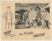 2d426 MR. HULOT'S HOLIDAY LC '54 Jacques Tati smiles at woman sitting outside beach changing room!