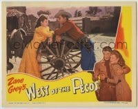 2d730 WEST OF THE PECOS LC '45 Robert Mitchum & Barbara Hale flirting over wagon wheel!