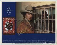 2j0279 BRONCO BILLY signed LC #2 '80 by Clint Eastwood, who's close up by prison cell!