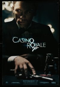 2t210 CASINO ROYALE teaser DS 1sh '06 Craig as James Bond sitting at poker table w/gun!