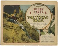 3c329 TEXAS TRAIL TC '25 cowboy Harry Carey helps Ethel Shannon climb steep mountainside!