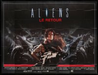 3r001 ALIENS French 8p '86 James Cameron, close up of Sigourney Weaver carrying little girl!