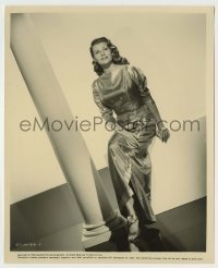 3s633 RITA HAYWORTH 8x10 still '56 full-length seated in cool dress with her legs crossed!