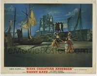 4s671 HANS CHRISTIAN ANDERSEN photolobby '53 far shot of dancing girls by men hauling wood to boat