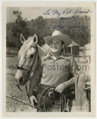 5y473 WHIP WILSON signed 8.25x10 still '50s portrait of the cowboy star standing by his horse!